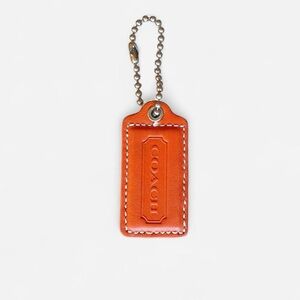 Coach orange leather hang tag